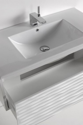 <p>
	Mueble de baño realizado en material MDF lacado blanco acabado alto brillo formado por un cajón de gran capacidad con sistema de cierre amortiguado suave. Frontal con relieve acabado lacado alto brillo.Lavabo cerámico y espejo 75x90 sobre tablero incluidos. Fabricado en España.</p>
